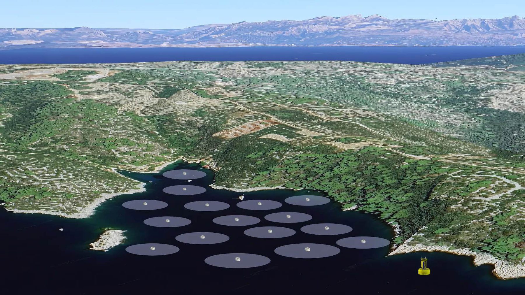 Aerial view of an eco-mooring field in a sheltered bay